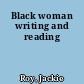 Black woman writing and reading
